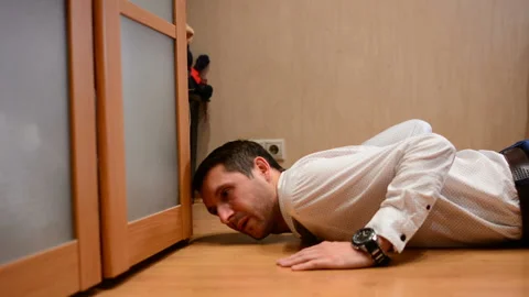 Office manager doing push-ups in at home Stock Footage 91186908