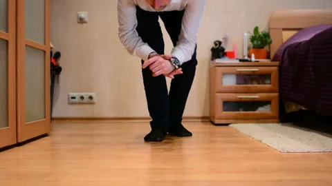 Office manager doing push-ups in at home Stock Footage 91187116