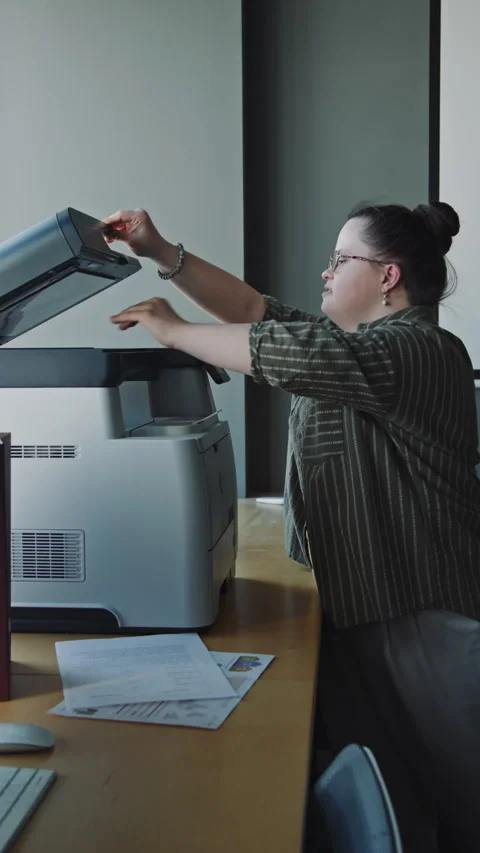 Office Manager with Down Syndrome Copying Document on Printer Video stock 275066754