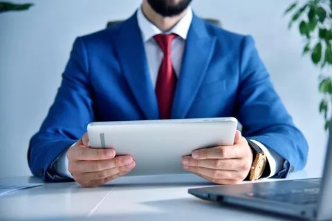 Office manager hands using tablet computer. Stock Photos