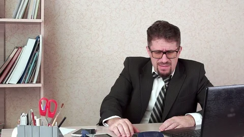 Office Manager man with beard is hot at work. Sweating Stock-Footage 100420790