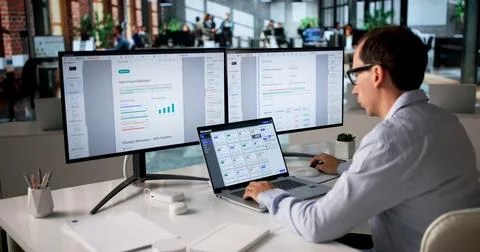 Office Manager Organizes Files On Computer Using Secure Document Management S Stock Photos
