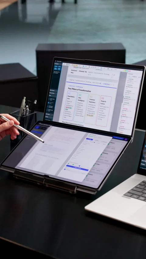 Office Manager Organizing Digital Documents On Dual Touchscreen Laptop Video stock 337642893