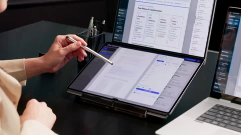 Office Manager Organizing Digital Documents On Dual Touchscreen Laptop Stock Footage 339908716