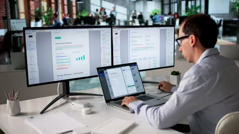 Office Manager Organizing Files On Computer Video stock 334926781
