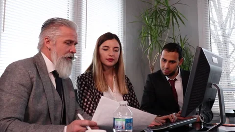 Office Manager Is Overseeing The Work Of A Young Female Employee Stock Footage 153608288