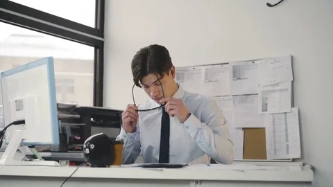Office manager rejoicing and throws up papers at work place. 4K Video stock 85133479