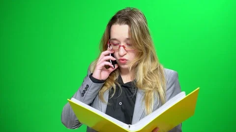 Office manager with a report folder. It does not agree with the data. Insists on Stock Footage 89290313