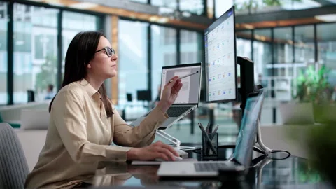 Office Manager Reviewing Digital Documents On Laptop Stock Footage 338171334