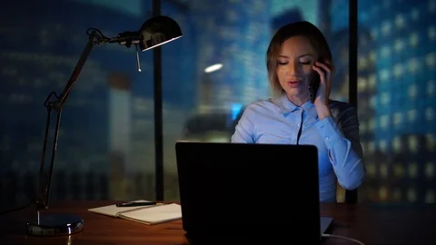 Office manager working with laptop talking on the phone Stock Footage 95399151