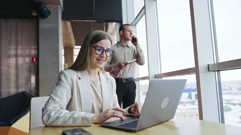 Office managers working together with laptop. Stock Footage 187154171