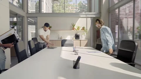 The office meeting begins and the workers take their seats. Creative business Stock Footage 166345827
