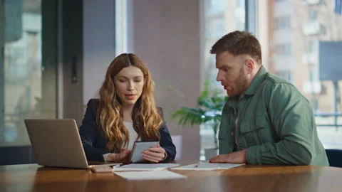Office mentor learning intern sitting desk with laptop. Confident businesswoman Stock Footage 281528024