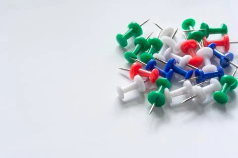 Office or school objects. Multi colored Push Pins isolated on White Backgroun Stock Photos