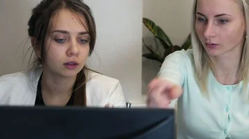 Office or security workers sitting and working together in front of their Stock-Footage 85571273