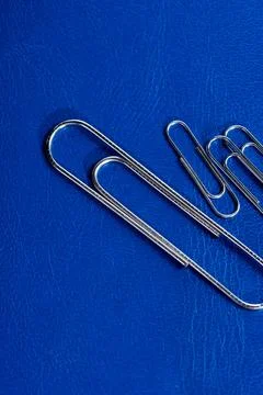 Office paperclips on table Stock Photos