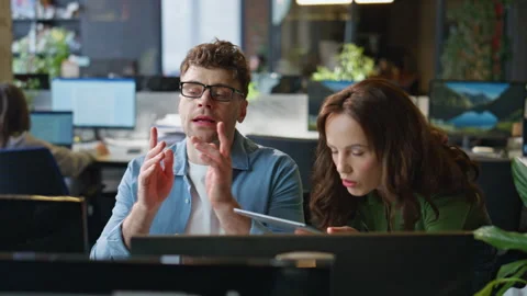 Office partners working together solving problem closeup. Lady consulting man Stock Footage 282738462