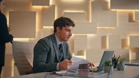 Office partners working together solving business. Closeup colleagues pondering Stock Photos