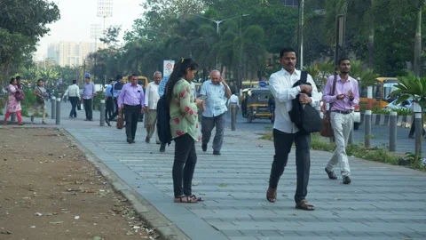 Office people walking down the streets after the office working hours are Video stock 239821548