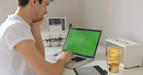 Office person using laptop computer with Chroma key. Talented Young Artist work Video stock 127492253