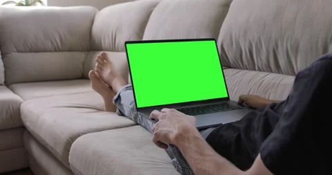 Office person using laptop computer with laptop green screen staying at home Stock Footage 138253081