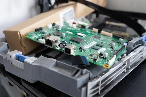 Office printer circuit board during repair Stockfoto's
