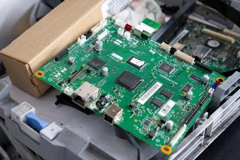 Office printer circuit board during repair Stockfoto's