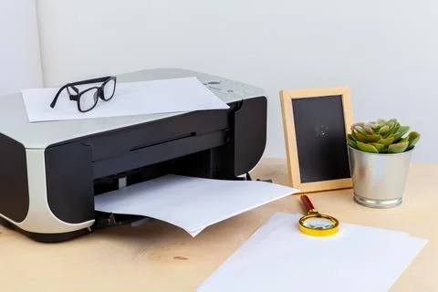 Office printer close up on a wooden table Foto stock