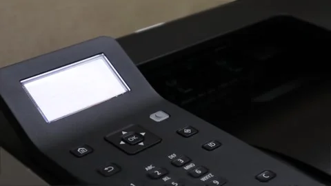 An office printer closeup while printing a paper sheet Stock Footage 278458151