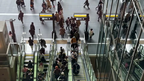 Office professionals and workers moving in and out of train station Stock Footage 250499429