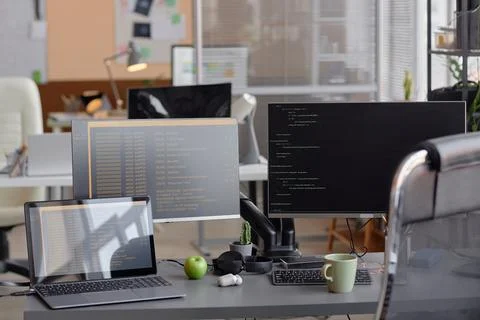 Office Programming Desk Setup with Computer and Laptop Foto stock