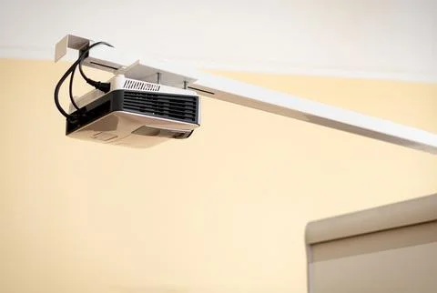 Office projector in front of the screen Stock Photos