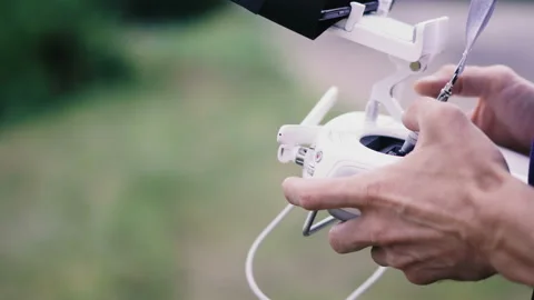 Office quadcopter. Hands control quadcopter with joystick. Video stock 112315965