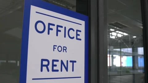 Office for rent signboard outside an empty office lot. Stock Footage