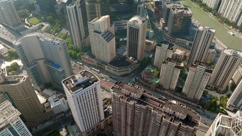 Office rooftops and intersecting streets from above in Shanghai 스톡 동영상 346583819