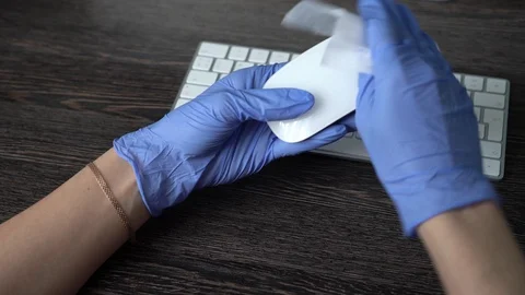 Office sanitizing wipe wiping mouse with disinfecting wipes. COVID-19 Stock Footage 128493054