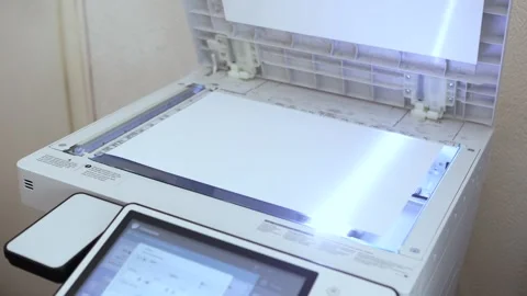  An office scanner performs the process of scanning an A4 document Stock Footage 294976054