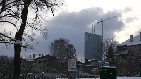 Office skyscraper downtown winter clouds snow crane estabilishing shot Stock Footage 92141086