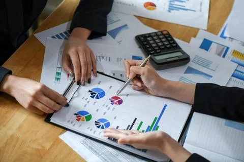 Office staff is summarizing the work to present the management. Stock Photos