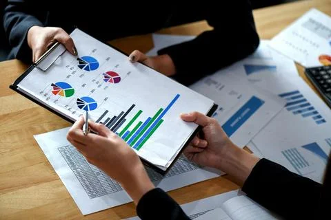 Office staff is summarizing the work to present the management. Stock Photos