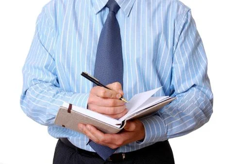 Office staff writes notes in the diary Stock Photos