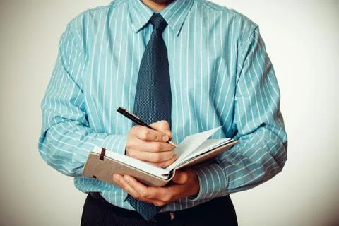 Office staff writes notes in the diary Stock Photos