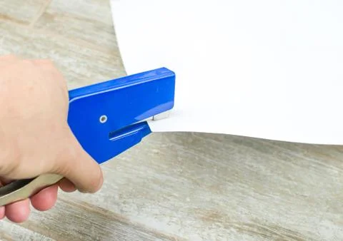 Office stapler hand Stock Photos