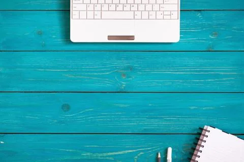 Office stuff with laptop, notebook and pencil on rustic wooden background Stock Photos