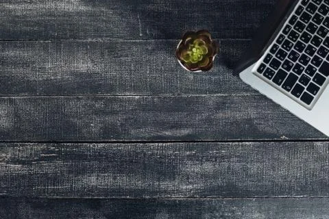 Office stuff with notepad, laptop and coffee cup mouse notepad top view shot. Stock Photos