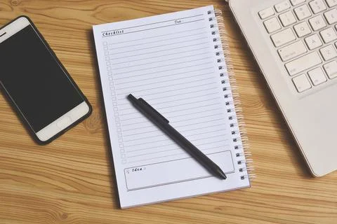 Office stuff with notepad, laptop and smartphone top view shot Foto stock