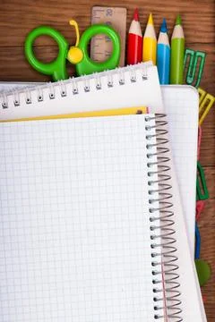 Office supply and blank notepad on wooden table Stock Photos
