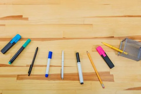 Office table with accessories: a marker of blue and pink colors, a pen, a pen, a 写真素材