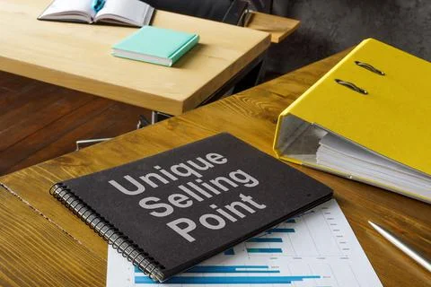 Office table and notepad with USP unique selling point. Foto stock