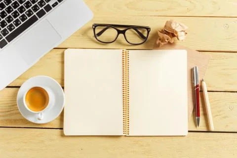 Office table background with coffee cup, pencils and computer keyboard. Busin Stock Photos